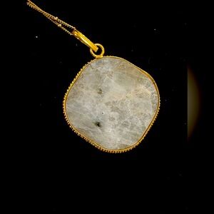 Moonstone necklace pendant comes with gold plated chain.  Natural crystal